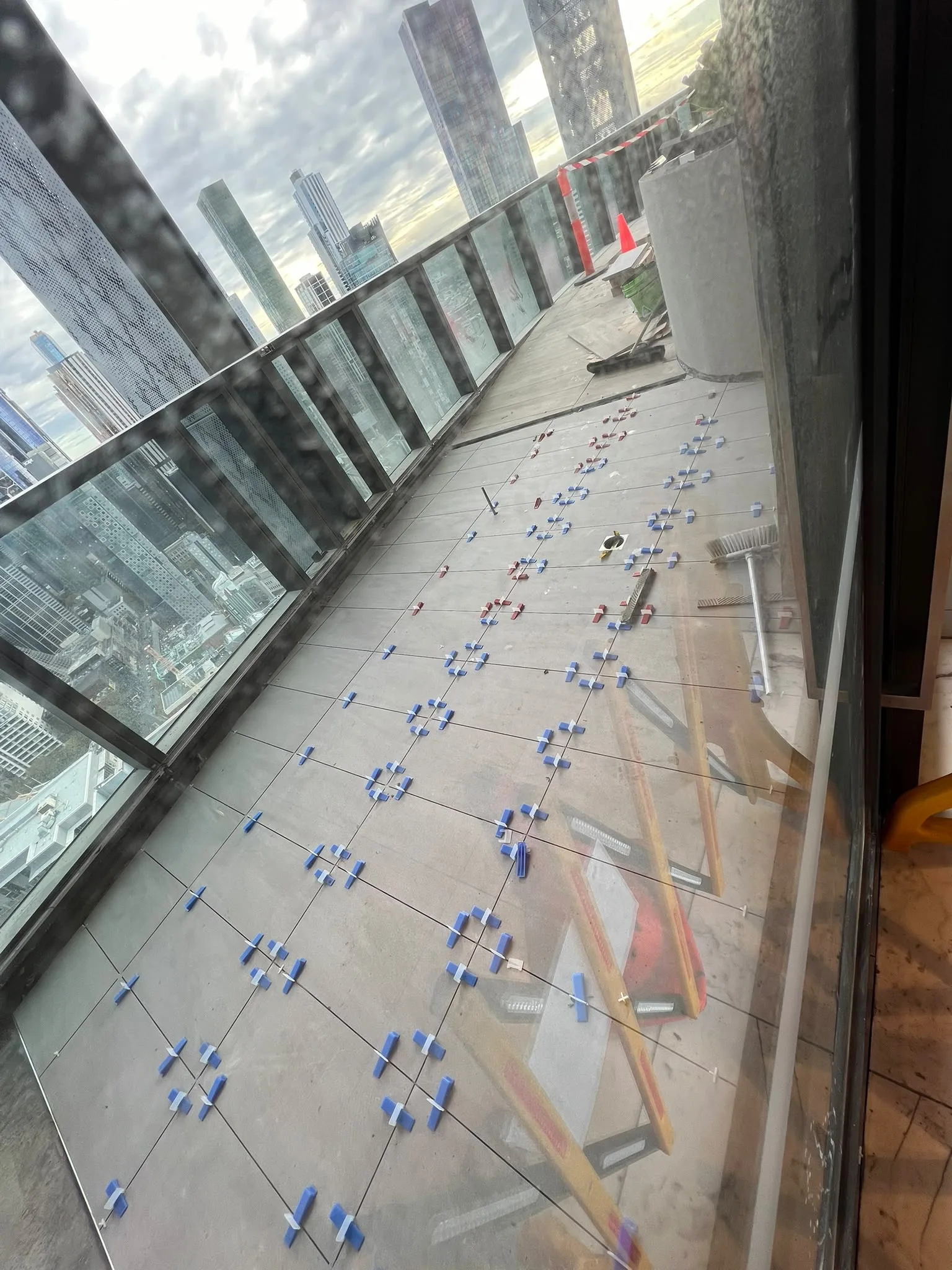 Outdoor apartment balcony with weather-resistant exterior tiling and joint protection